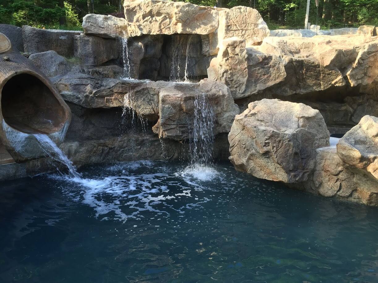 Custom concrete waterfall and outdoor water feature